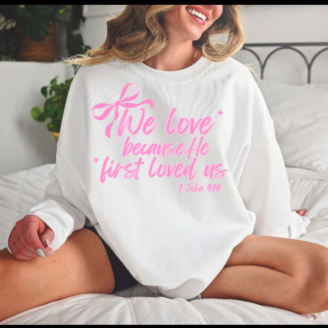 “We love because he first loved us” 1 John 4:19 Crewneck